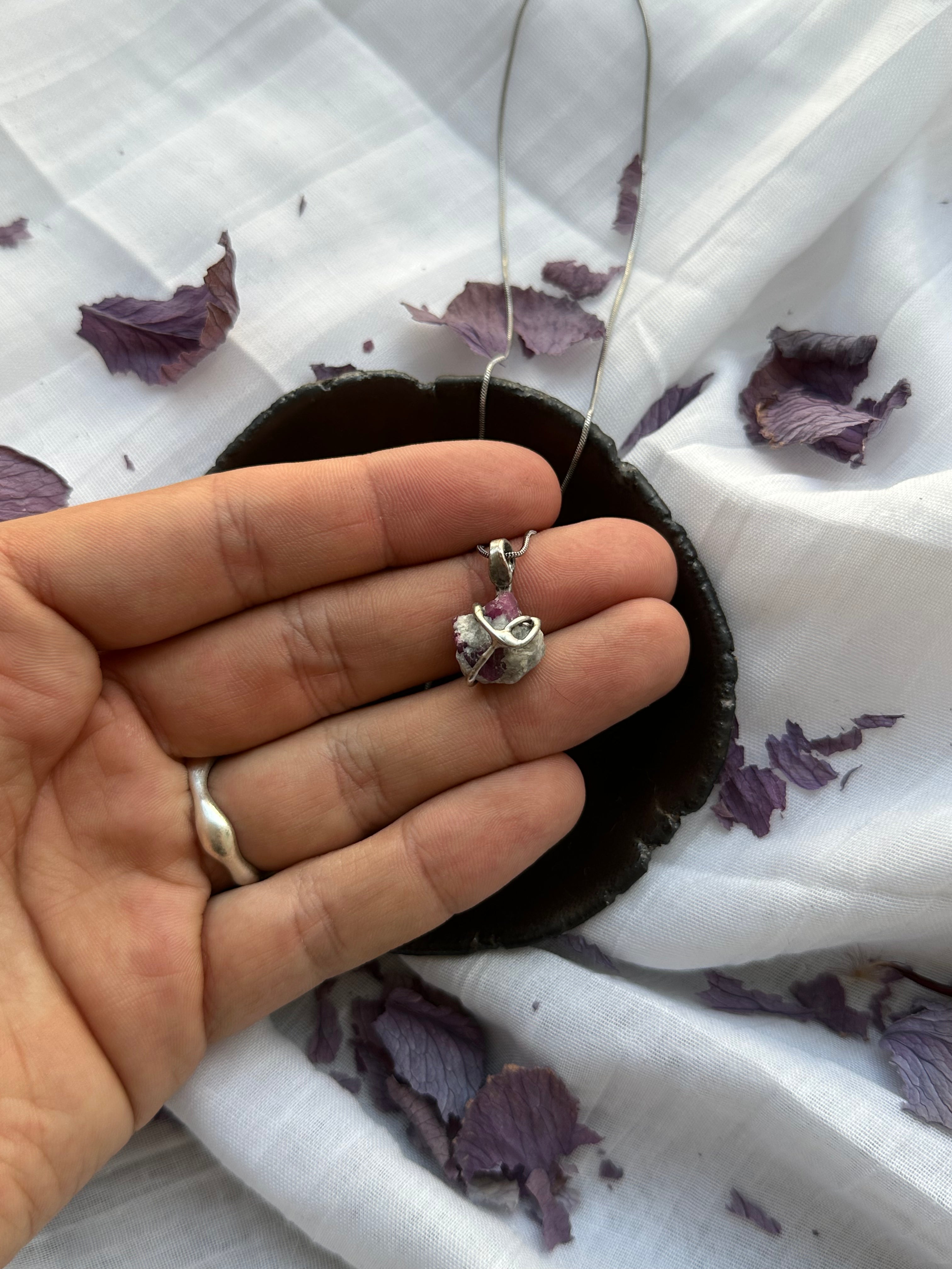 “Core Flame” – Raw Ruby Pendant by Laura Řezaninová